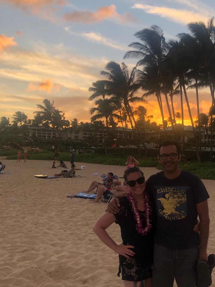 Jake and Salena on a beach in Hawaii at sunset