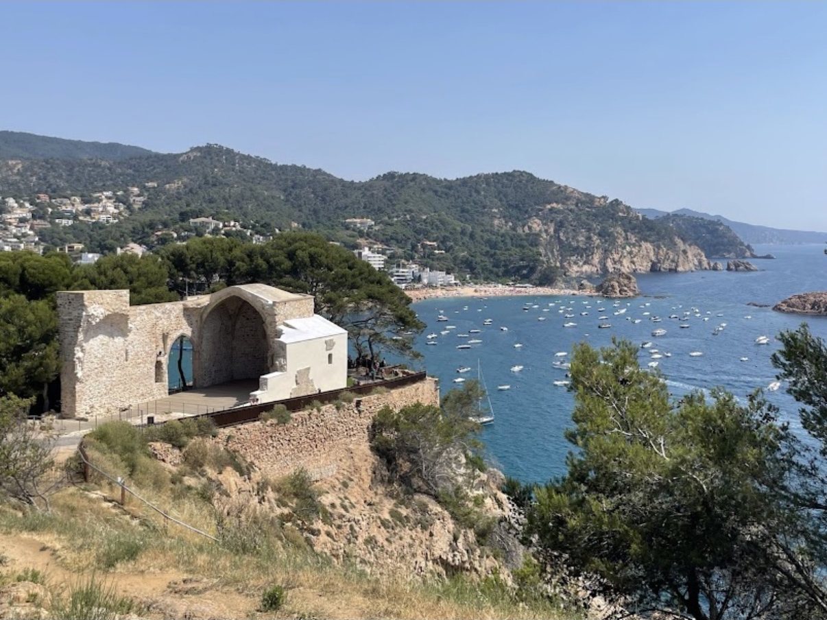The ruined Església Vella de Sant Vicenç on the cliff in Vila Vella, above the bay of Tossa de Mar
